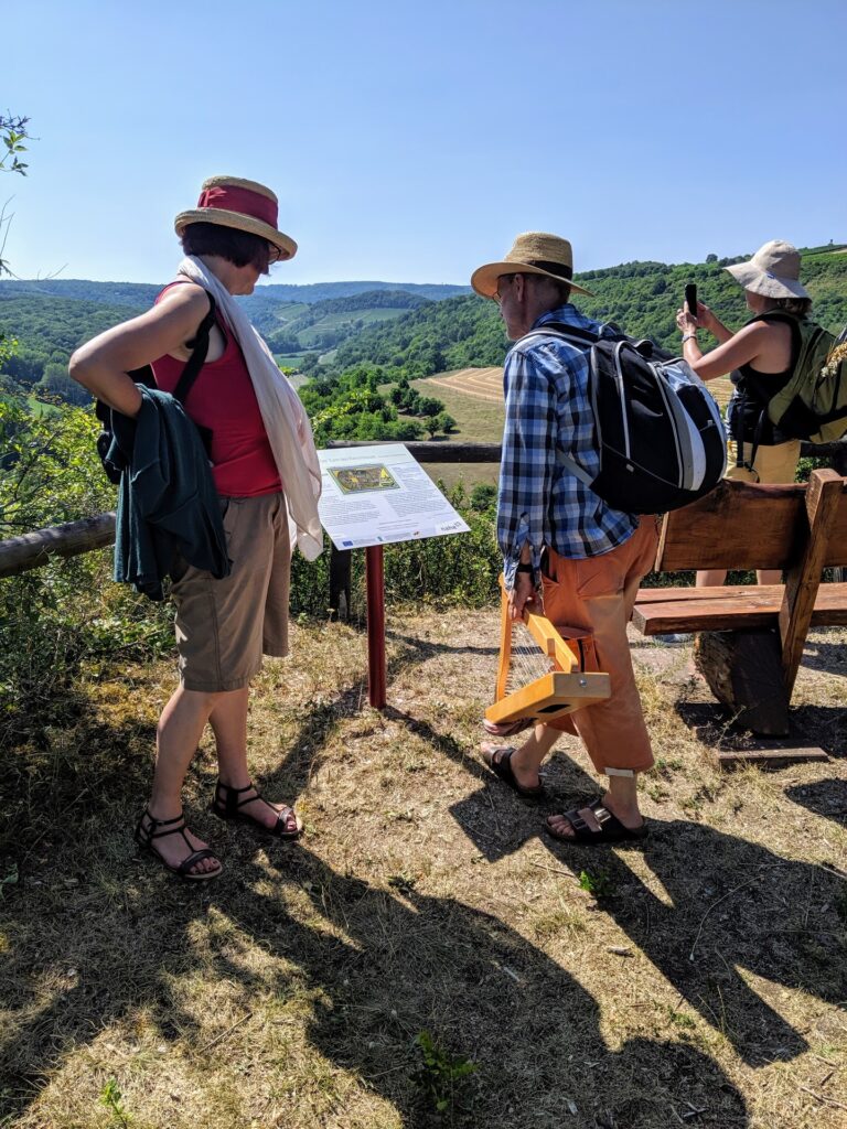 Pilgrims along the Hildegard Way, reading from one of the fifty-nine tableaus along the trail.