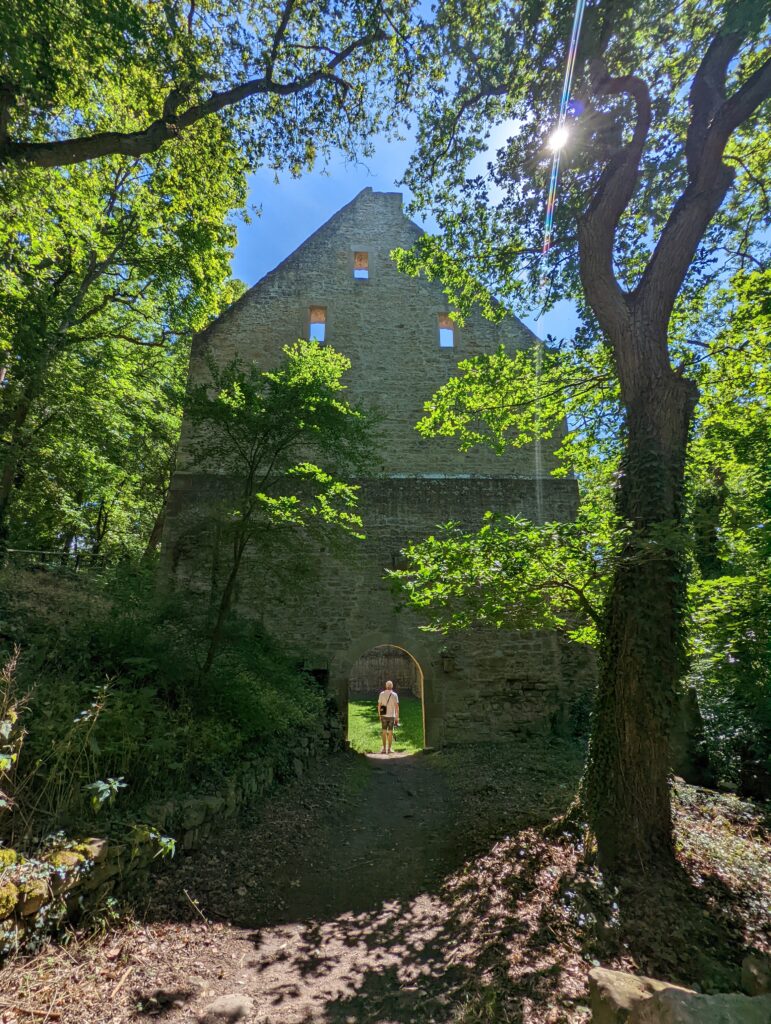 Pilgrim walks in ruins of Ruins of the Monastery